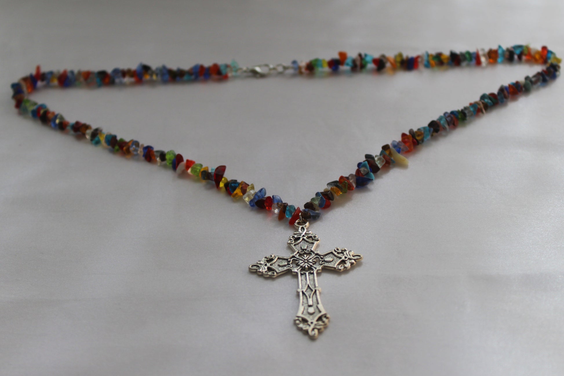 Handmade multicolour natural gemstone chip necklace featuring an antique silver cross pendant with a lobster clasp, lightweight Christian handmade jewellery.